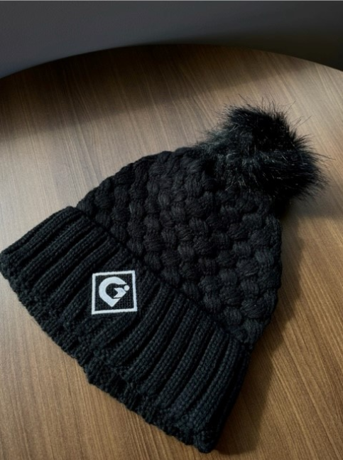 Black hat with pompom
